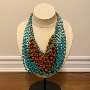 Multi coloured and multi strand bead necklace.